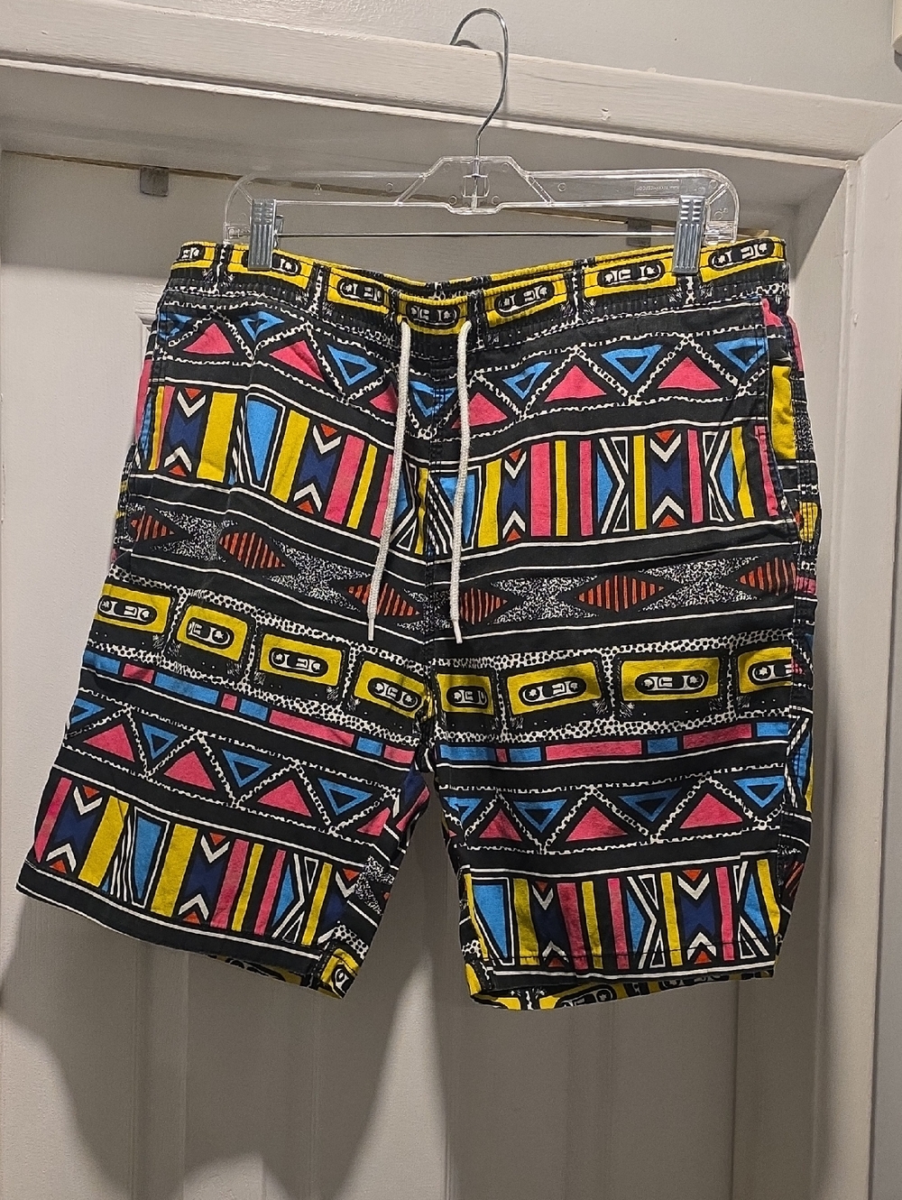 Divided Men's Black Geometric Shorts with Yellow, Blue & Pink Pattern